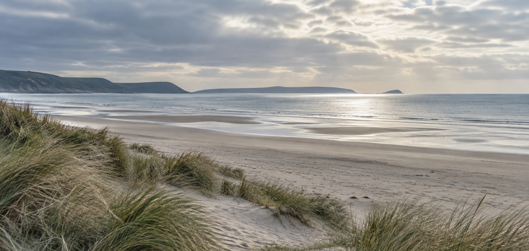 Quiet sandy coastline near Swansea Bay
